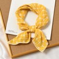 Bright yellow cotton linen square scarf with geometric pattern tied as a neckerchief - Geometric Grid Yellow