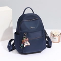 Blue Oxford nylon backpack for women with gold zippers and a cute bear keychain accessory - Large / Blue