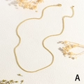 Detail of golden twist rope chain necklace with lobster clasp and adjustable extension - Chain Style (MNE0138)