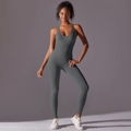 Macro shot of seamless grey athletic jumpsuit featuring flexible sculpting fabric and U-neck - Dark Gray