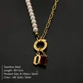 Stainless steel necklace with pearl chain, letter O pendant and red crystal stone - Gothic Letter O