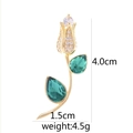 Elegant gold tulip brooch with green faceted gemstones and size labels 4.0cm by 1.5cm - D9025JL Flower