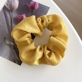 Luminous yellow satin scrunchie with soft pleated texture and silk-like finish - Yellow