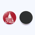 Detail of round red Christmas fridge magnet with white tree and Merry Christmas text - Red Christmas Tree