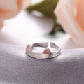 Detail of adjustable S925 silver cat ear ring with pink enamel on purple satin - Pink Cat Ears