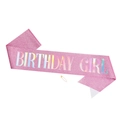 Macro detail of pink glitter birthday girl sash with holographic text and gold safety pin - Pink Fabric Holographic GIRL