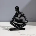 Nordic abstract thinker sculpture in matte black resin for desk decor, 11.5cm height - Black Left Reading