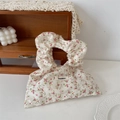 Detail of floral canvas wristlet bag with ruffled handle and vintage pastoral patterns - Twill Floral Red