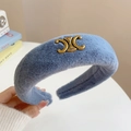 Light blue faux fur headband featuring a vintage gold metal buckle design - Celine Triomphe Logo Plush Style / Blue