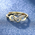 Golden ring with infinity and heart design set with clear stones on blue background - Gold Ljz-207 / Adjustable Open