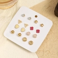 Fashionable twisted stud earring set with various shapes on a jewelry card display - Set 2 (Pearl + Twist Shape)