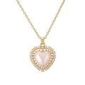 Elegant gold plated heart pendant necklace with center pearl and hollow metal details - Pearl Vintage Heart Necklace (CN001784CX)