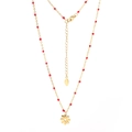Detailed close-up of golden stainless steel chain with red beads and daisy flower pendant - Red