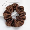 Macro detail of a dark brown satin scrunchie with a glossy silk texture on a white plate - Coffee (Large)