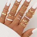 21-piece gold knuckle ring set with butterfly, leaf motifs and pearl accents on model hand - Gold Butterfly Leaf Combination (5766201HB)