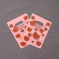 Detail of pink plastic gift bag with cute cookie bear pattern and top handle - Cookie Bear Style (6) / 95 Pieces/Pack