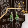 Cloisonne peacock earrings in green and silver with rhinestones on a wooden branch - Green Enamel Rhinestone Peacock