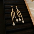Detail of long gold pearl tassel earrings with geometric U-shape in a black jewelry box - Gold Fork Pearl (77#)