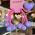 Detail of purple elastic hair ties with heart pendants and brand display card - Violet