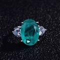 Macro view of pear-shaped Paraiba tourmaline stone with micro-pave diamond setting - Adjustable Open / Style E-Paraiba Oval Three Stone