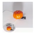 Detail view of orange pumpkin hair clip with dimensions L 3cm and H 2cm on black metal clip - Pumpkin Style