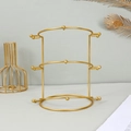 Detailed view of golden 3-tier metal crown stand with side hooks and curved supports - Gold 3 Tiers
