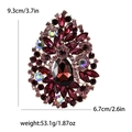 Dimensioni dettagliate della spilla con strass con misura 9,3 cm x 6,7 cm e peso di 53,1 g - Viola