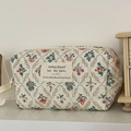 Detail of floral quilted cotton makeup bag with cream zipper and side carrying handle - French Garden [Octagonal Pouch]