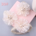 Detailed close-up of three infant floral headbands with champagne mesh and pearl accents - Style 30 (Beige Mesh Flower Clip/Bow Set)
