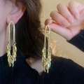 Elegant gold-plated long tassel earrings with layered leaf design on model - Silver Earring Post Leaf Wheat Ear Tassel (35#)