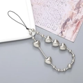 Silver beaded phone strap with varied round beads and a heart charm on a vintage paper - Silver Heart Beaded Style (K2908)