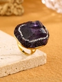 Detailed close-up of a large purple raw crystal ring with red and white diamond accents - Adjustable Open / Amethyst with Purple Rhinestones