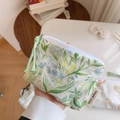 Detail showing floral cotton mini pouch with white zipper and simple wish label - White Green Branch