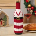 Knitted Christmas wine bottle cover with Santa belt design and festive red textures - Letter V