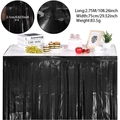 Detail of black foil fringe table skirt for party decor with adhesive tape and size specs - Black