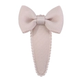 Detail of a beige ribbed fabric bow hair clip with decorative wavy scalloped edges - Beige