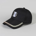 Close-up of sparkling rhinestone D-logo and crystal-embellished brim on black denim cap - Style 20-Black Rhinestone Letter D