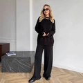 Completo in maglia nera con maglione a collo diviso e pantaloni ampi a vita alta - S / Nero