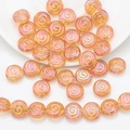 Detail of pink crystal glass beads with golden spiral patterns for DIY jewelry making - Gold Rose Red