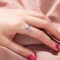 Close-up of adjustable silver ring with zircon stones on pink silk fabric background - Silver Dual Stone Open