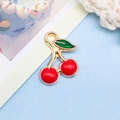 Red cherry charm pendant with gold base and green leaves for DIY jewelry making - 1 Piece (10x13mm)