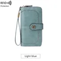 Light blue RFID blocking long wallet for women with pebble leather and wrist strap - Light Blue