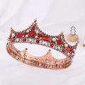Close-up of vintage gold Baroque crown with red gemstones and white pearls on fabric - Antique Red Copper with Red Rhinestone