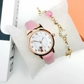 Pink cat dial watch with gold star and moon bracelet set on a white display pillow - Watch + Bracelet / Pink