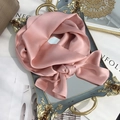 Elegant light pink mulberry silk scarf tied in a soft bow on a vintage vanity tray - 15x150cm / Hot Pink