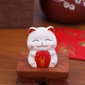 Cute white Maneki Neko figurine holding a red scroll with golden Joy lettering - XY005D Mini Happiness Lucky Cat Ornament