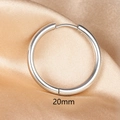 Detail view of 20mm polished stainless steel hoop earring on champagne silk background - 1PC / 20mm / Silver