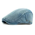 Retro light blue washed denim newsboy cap with white stitching and metal buckle - Adjustable / Medium Blue