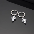 Macro shot of silver cross pendant earrings with zircon stones on a black reflective base - Cross Pendant Style (XK330-A) / Single Piece / Silver