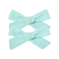 Set of two light green linen cotton bow hair clips with textured fabric on white background - Bow Hair Clips Set / Mint Green